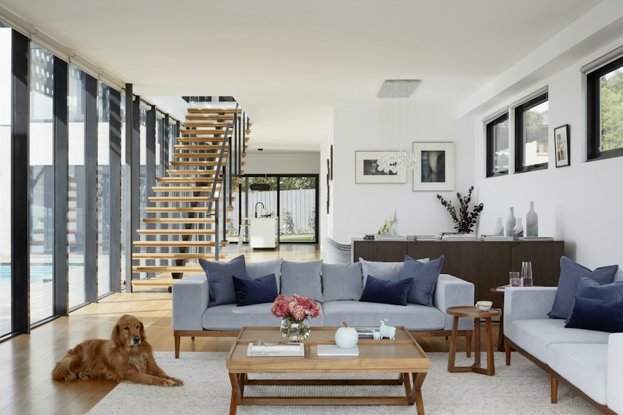 An open-plan family living room with comfortable seating and natural light